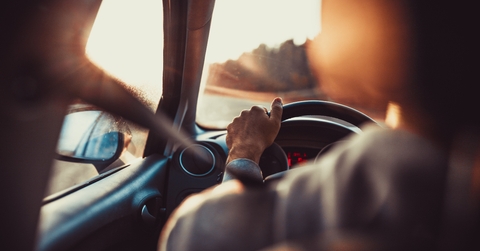 man driving car