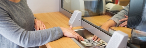 client receiving money from bank window