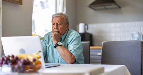 elderly man using laptop