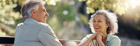 senior couple on bench at park