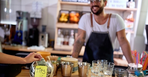 tips jar at table in cafe