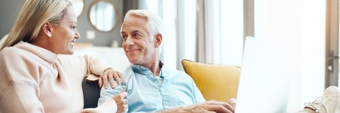 senior couple booking trip online