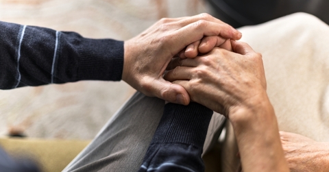 couple holding hands at family therapy
