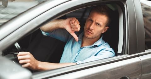 man showing dislike sign