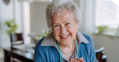 happy senior woman using smartphone