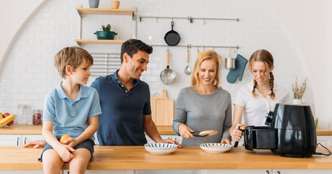 Father and mother preparing snacks