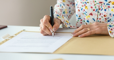 businesswoman signing contract