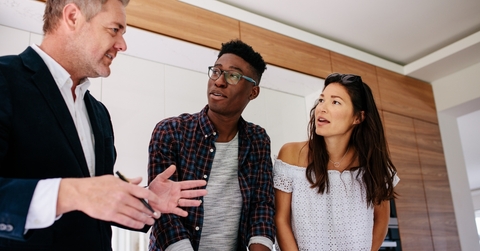 Interracial couple consulting realtor