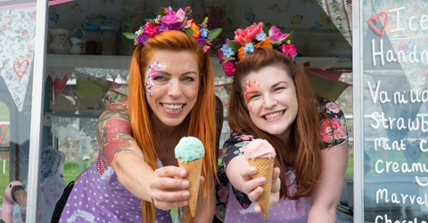 Two ladies holding ice cream from truck