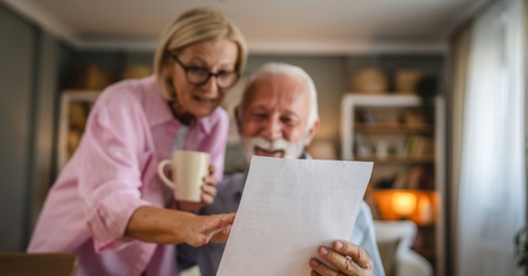 Couple reading a letter document