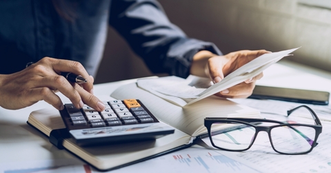 woman calculating bills at home