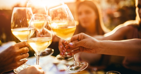 clinking glasses with wine