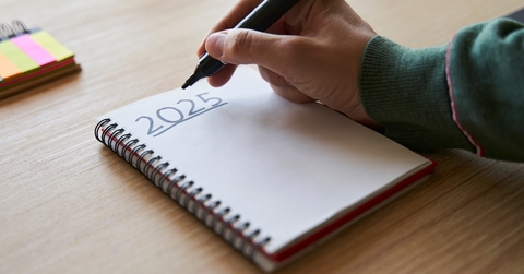 Hand writing 2025 New Year&#x27;s resolution concept