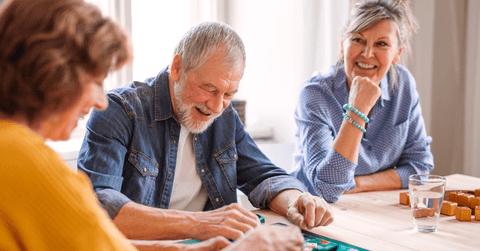 Senior people playing board games
