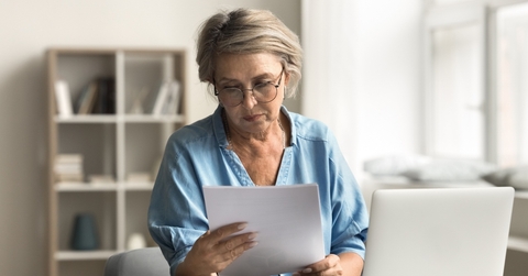 older woman reading document