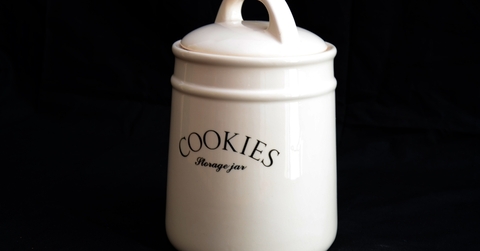 cookie jar over dark background 