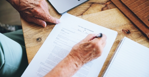 Senior signing a contract