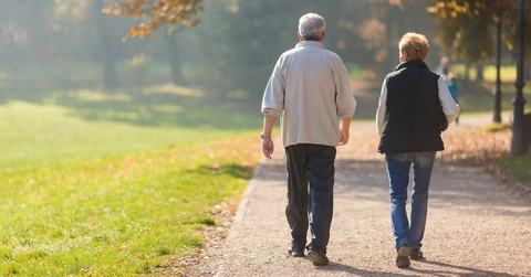 senior citizen couple taking a walk 