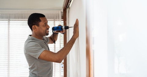 Man using electric drill