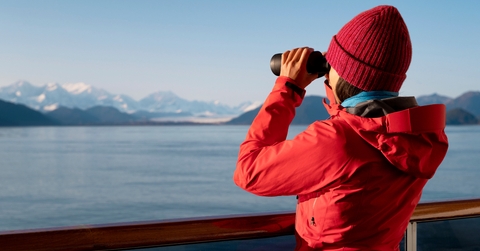 passenger looking at Alaskan mountains