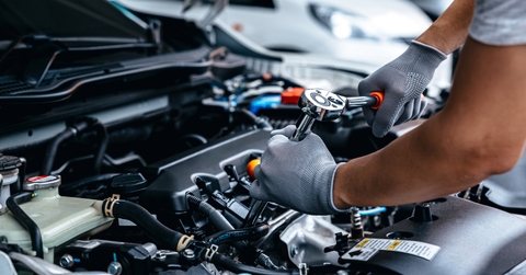 Mechanic doing maintenance on car