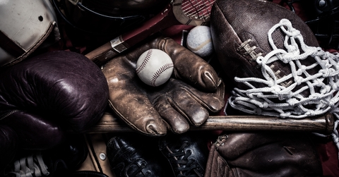 group of assorted vintage antique sports equipment