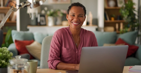 businesswoman using a laptop in her home office 