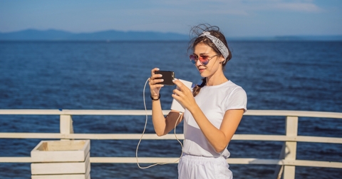 Woman using mobile phone on vacation