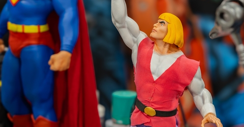 action figures of he-man and superman