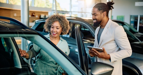 woman buying new car