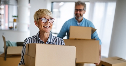 portrait of happy senior couple in love moving in new home