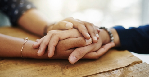 Holding hands in support