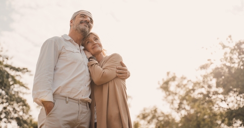 Happily retired couple at sunset
