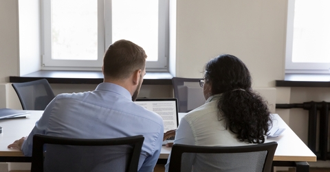 Mentor and intern editing text together