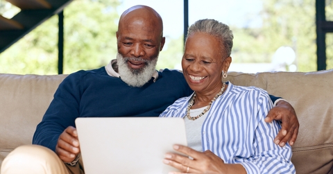Senior couple relaxing watching movie