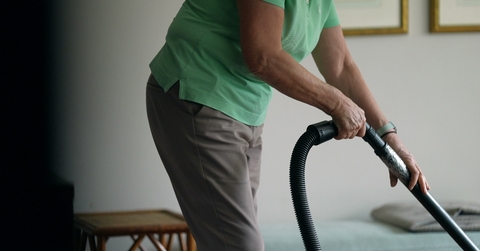woman cleaning with vacuum 