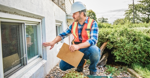 man with hard hat inspecting
