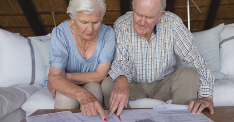 senior couple discussing over medical bills