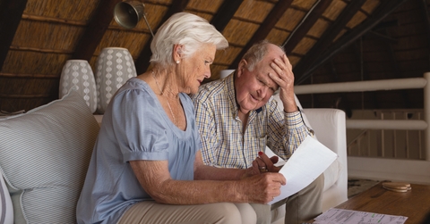 senior couple discussing over medical bills