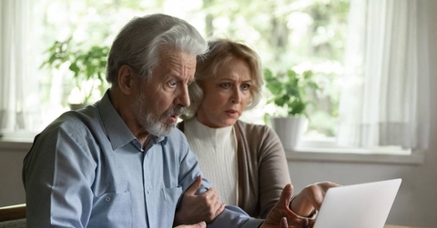 Shocked elderly spouses getting personal information hacked