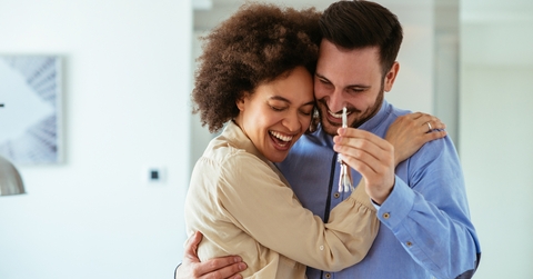couple excited with their new home