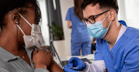nurse vaccinating patient