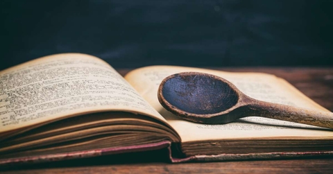 wooden spoon on a vintage book