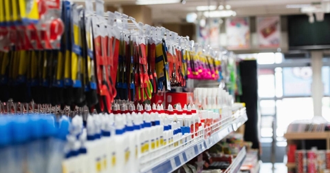 Rack with school supplies in stationery store