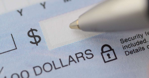 close up of pen writing the dollar amount