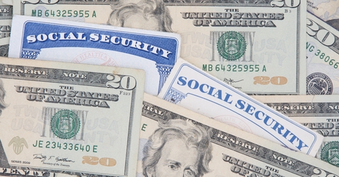 New and Old style Social Security cards with 20 dollar bills