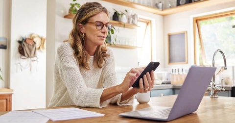 thinking mature person with technology