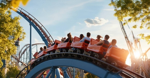 Group of friends having fun riding a roller coaster