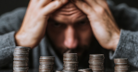 man stressed over money issues