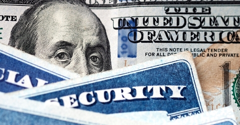 social security cards with dollar bill